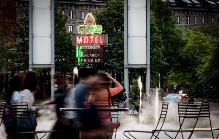 Always a lot of people scurrying about on the greenway - especially around the rings fountain. In the background is the Siesta Motel sign, which dates back to about 1950, and was orignally from Saugus MA.